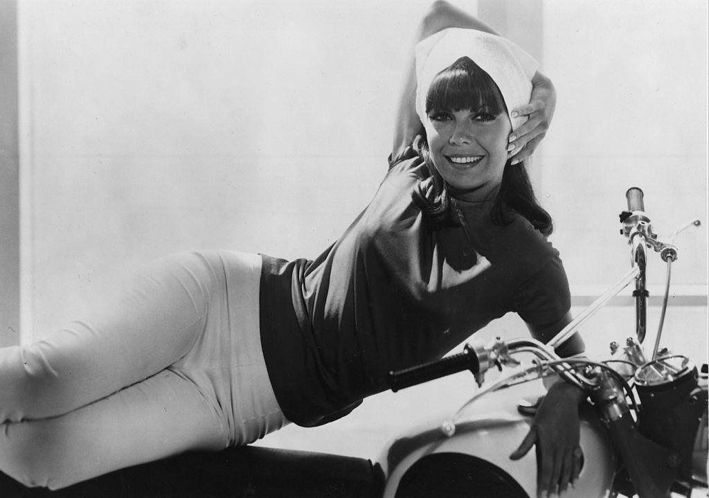 Nancy Sinatra posing on the motorbike, 1960.
