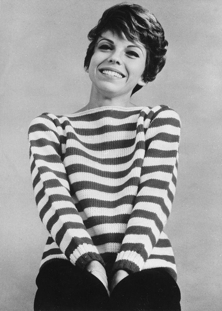 Nancy Sinatra wearing a stripped sweater, 1965.