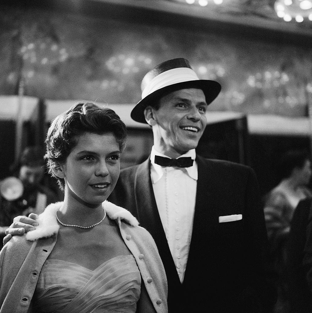 15-years-old Nancy Sinatra with her father, at the movie premiere, 1955.