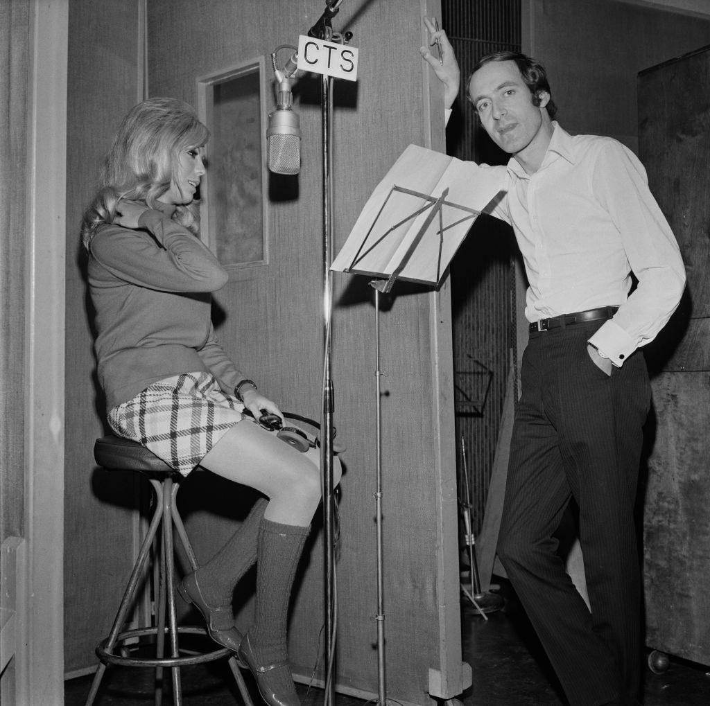 Nancy Sinatra and English composer John Barry at the CTS Studios recording James Bond them song 'You Only Live Twice', 1967.