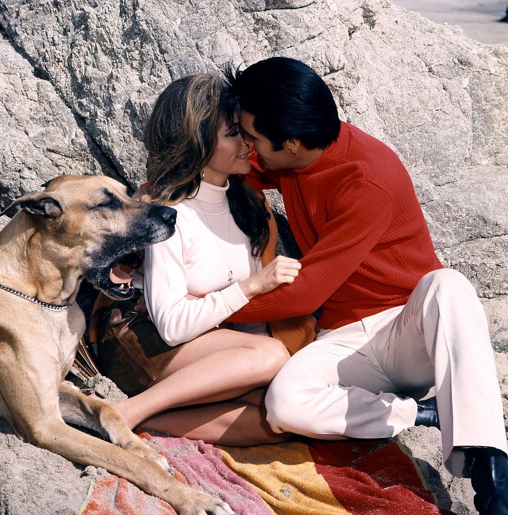 Nancy Sinatra with ELvis Presley in a scene from the film 'Speedway', 1968.