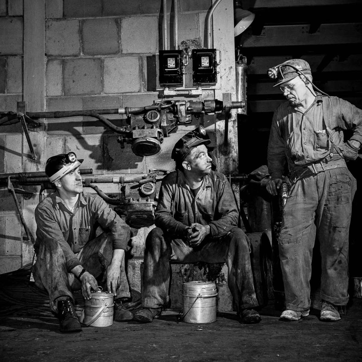 Miners break for lunch in the machine shop.