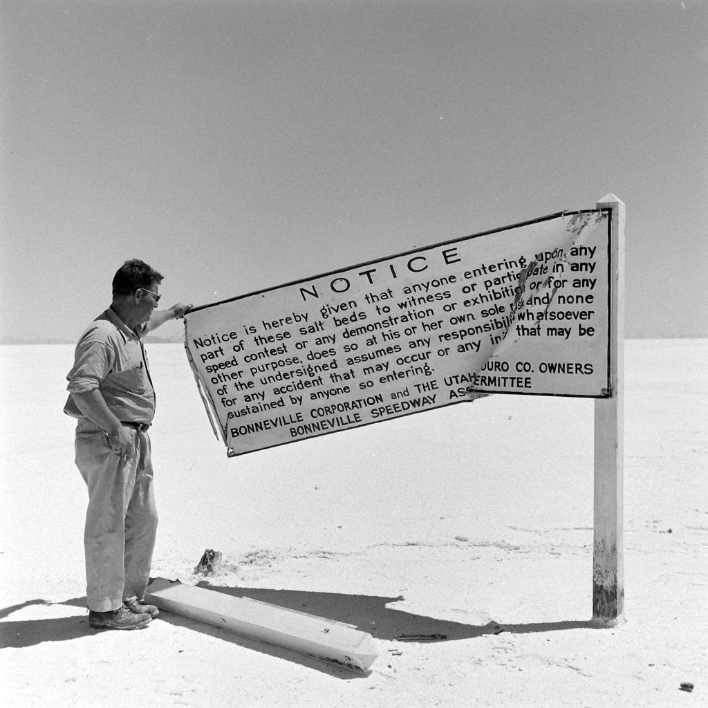 Man reading a notice at Great Salt Lake, Salt Lake City, June 1948.