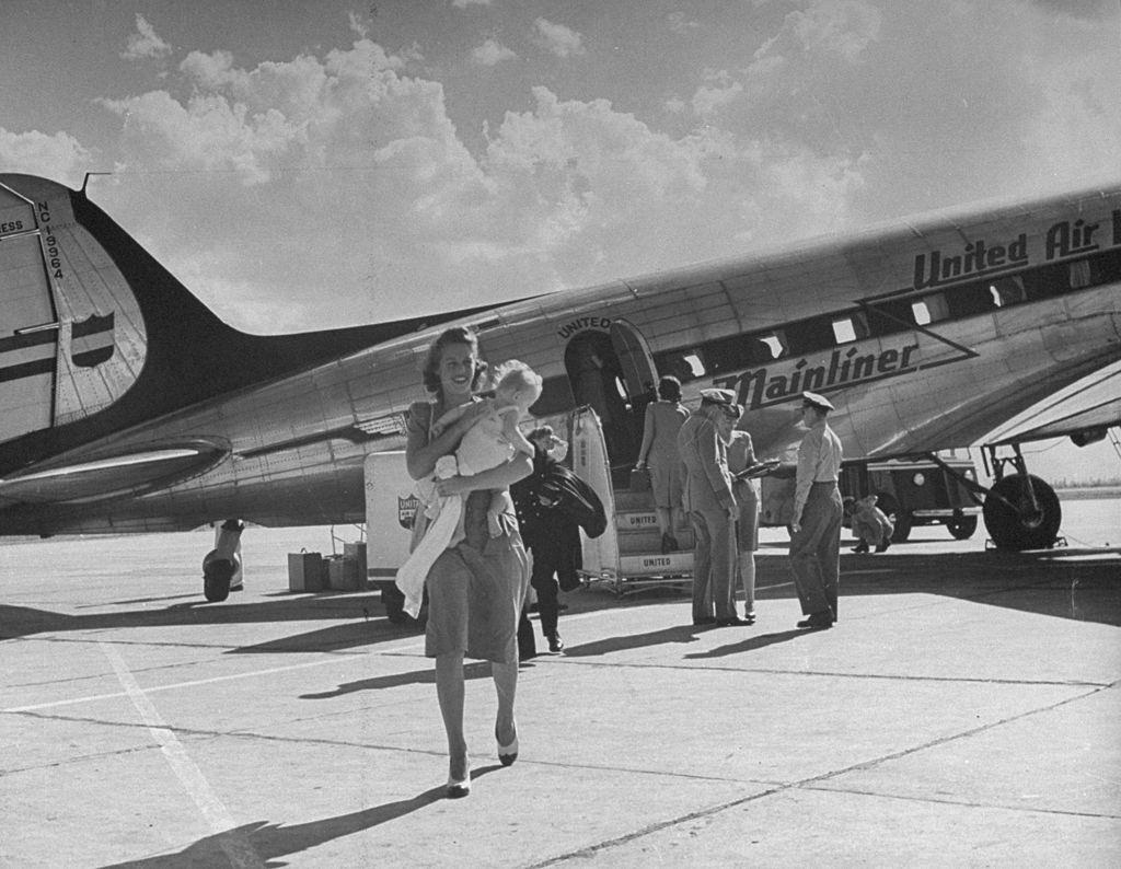 Passengers exiting the airplane after landing in Salt Lake City, 1945.