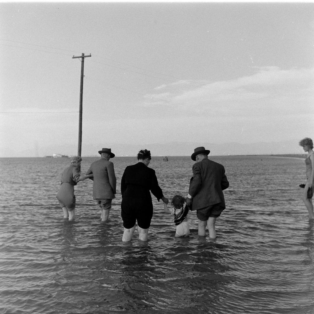 People walking on the Great Salt Lake, Salt Lake City, June 1948.