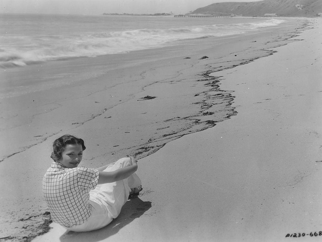 Sylvia Sidney on the beach in front of her Malibu home where she spends her time when she is not working, 1931.