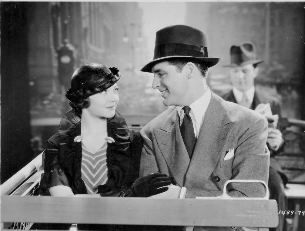 Sylvia Sidney and Cary Grant on an open top bus, 1934.