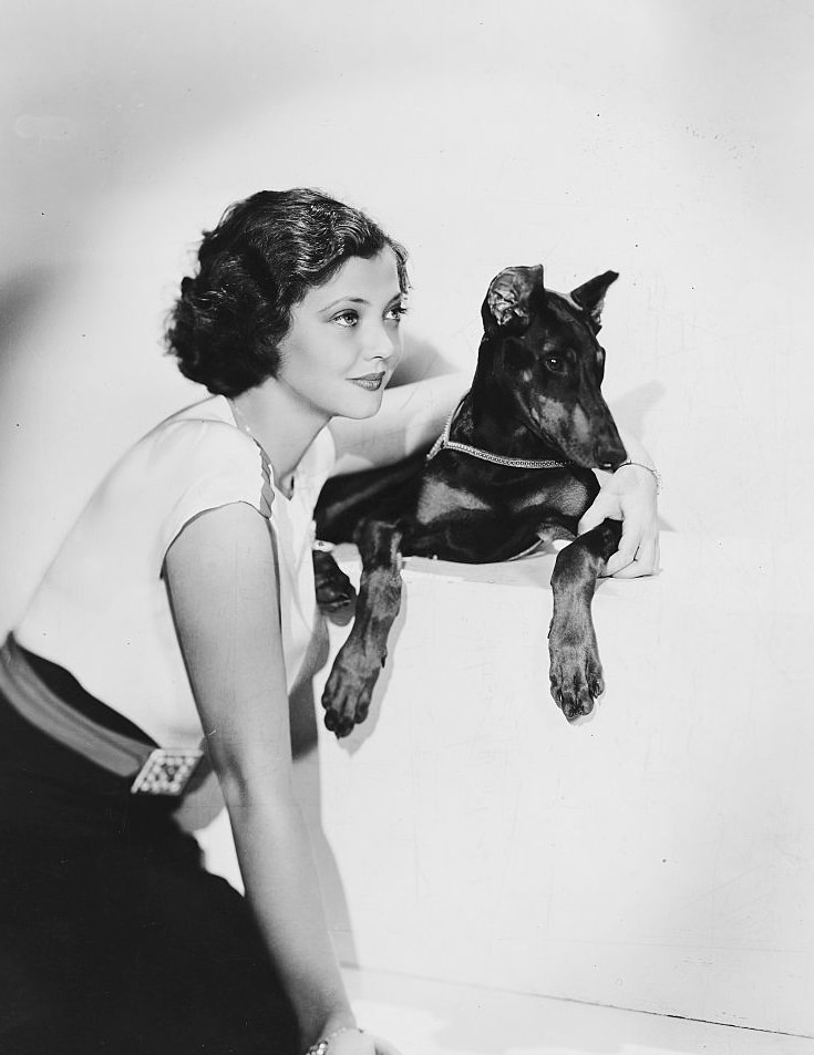 Sylvia Sidney with Doberman Pinscher, 1935.
