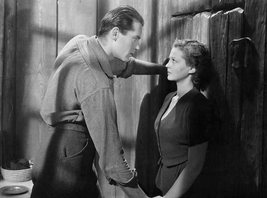 Henry Fonda looking seriously at Sylvia Sidney in a scene from the'The trail of the Lonesome Pine', 1936.