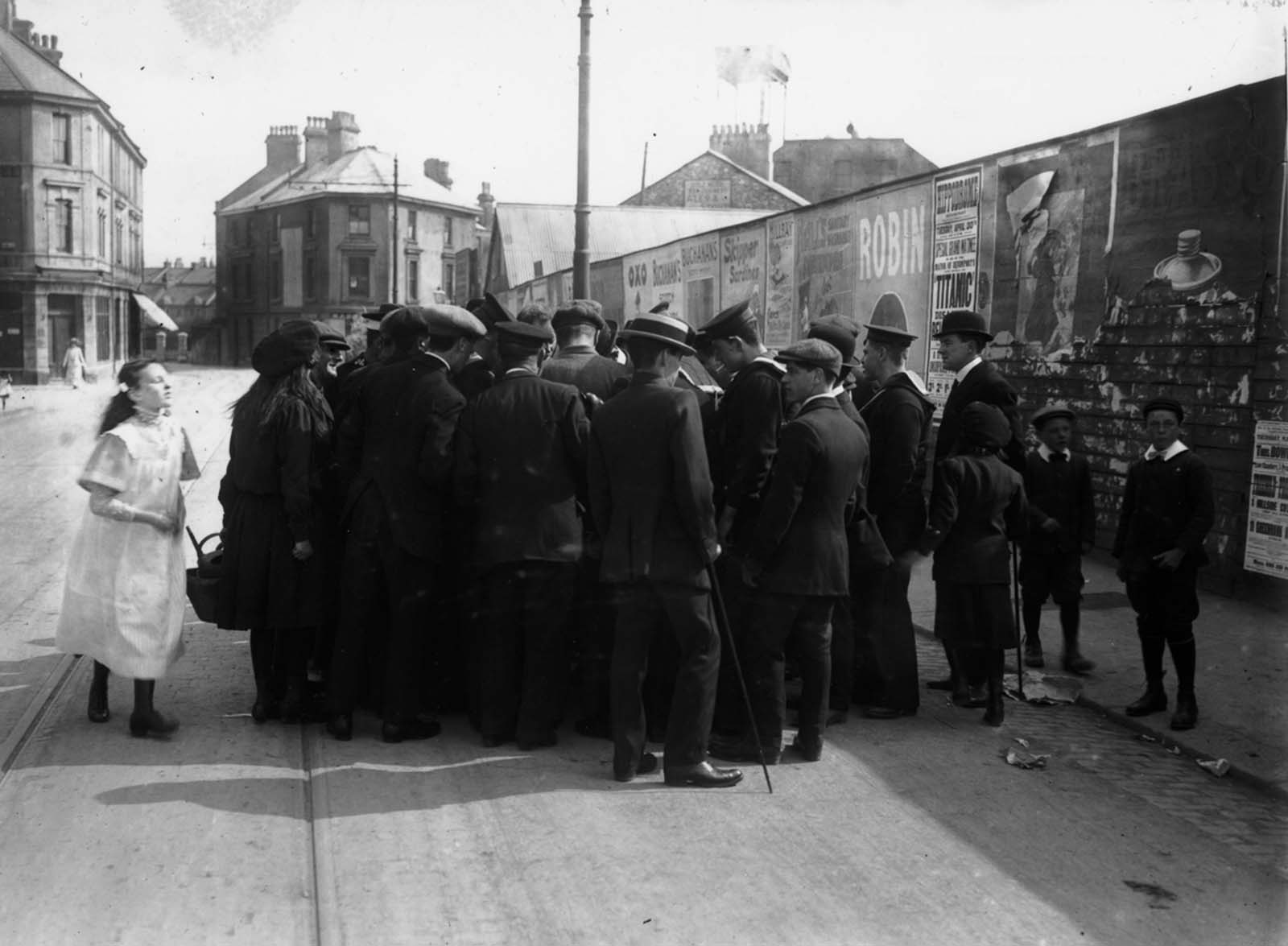 A crowd in Devonport gathers to hear a survivor tell his story.