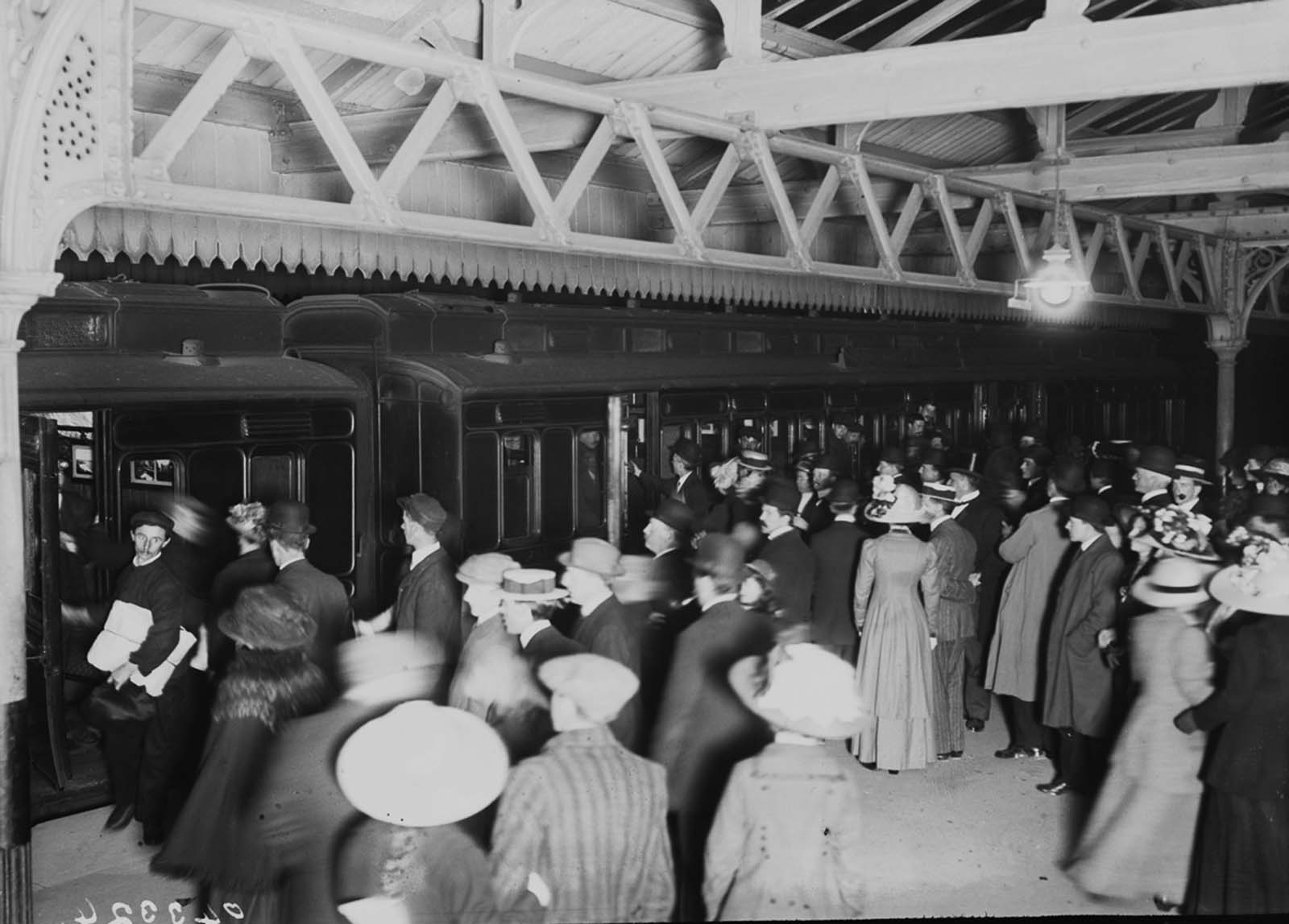 Relatives wait on a railway platform as survivors of the Titanic arrive at Southampton.
