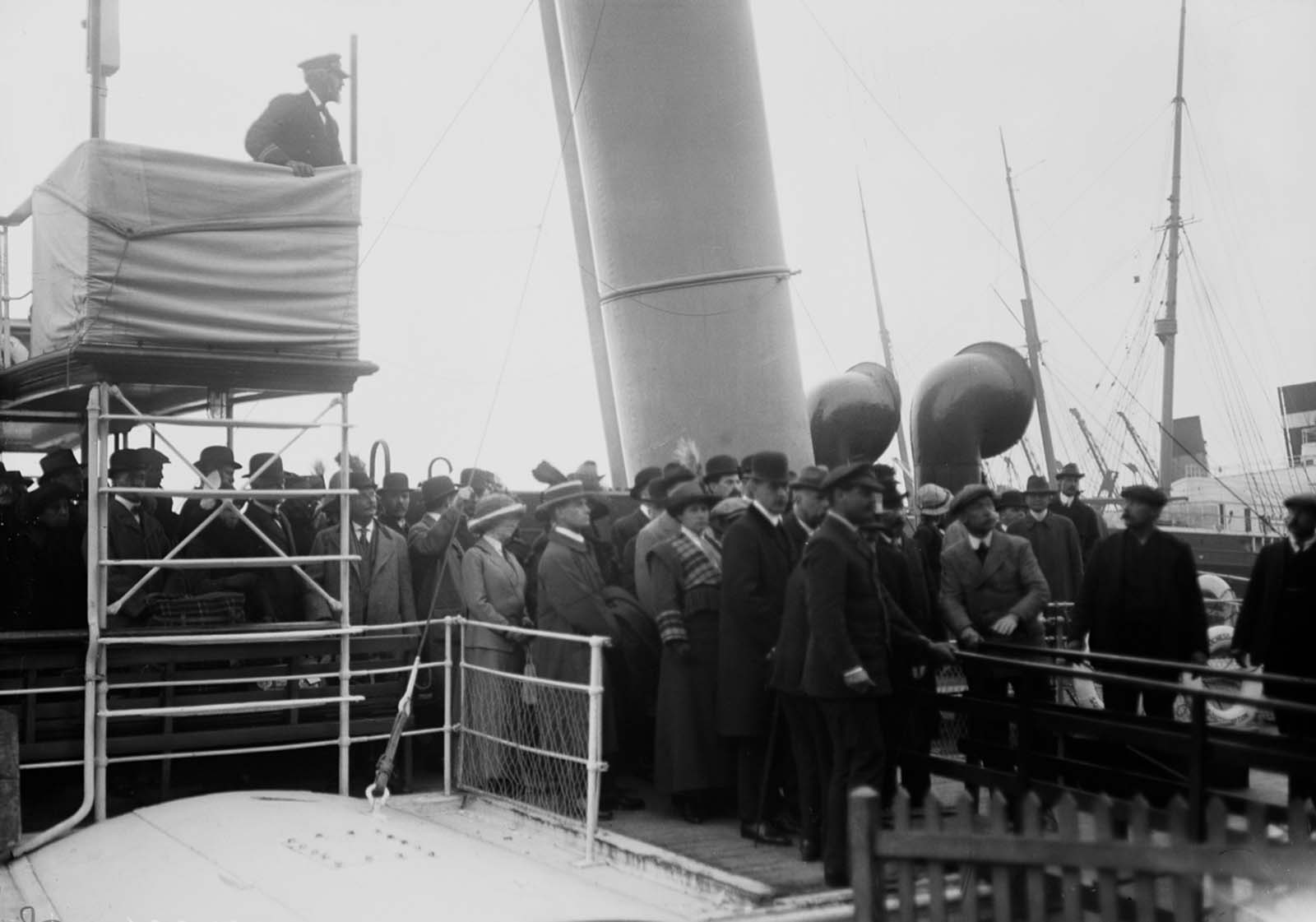 Relatives wait for the surviving crew to come ashore at Southampton.