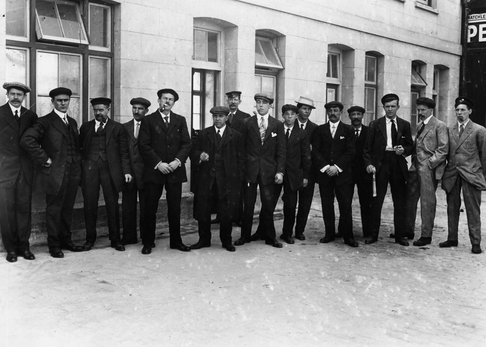 Surviving stewards line up outside a first-class waiting room before being called in for questioning by a board of inquiry.