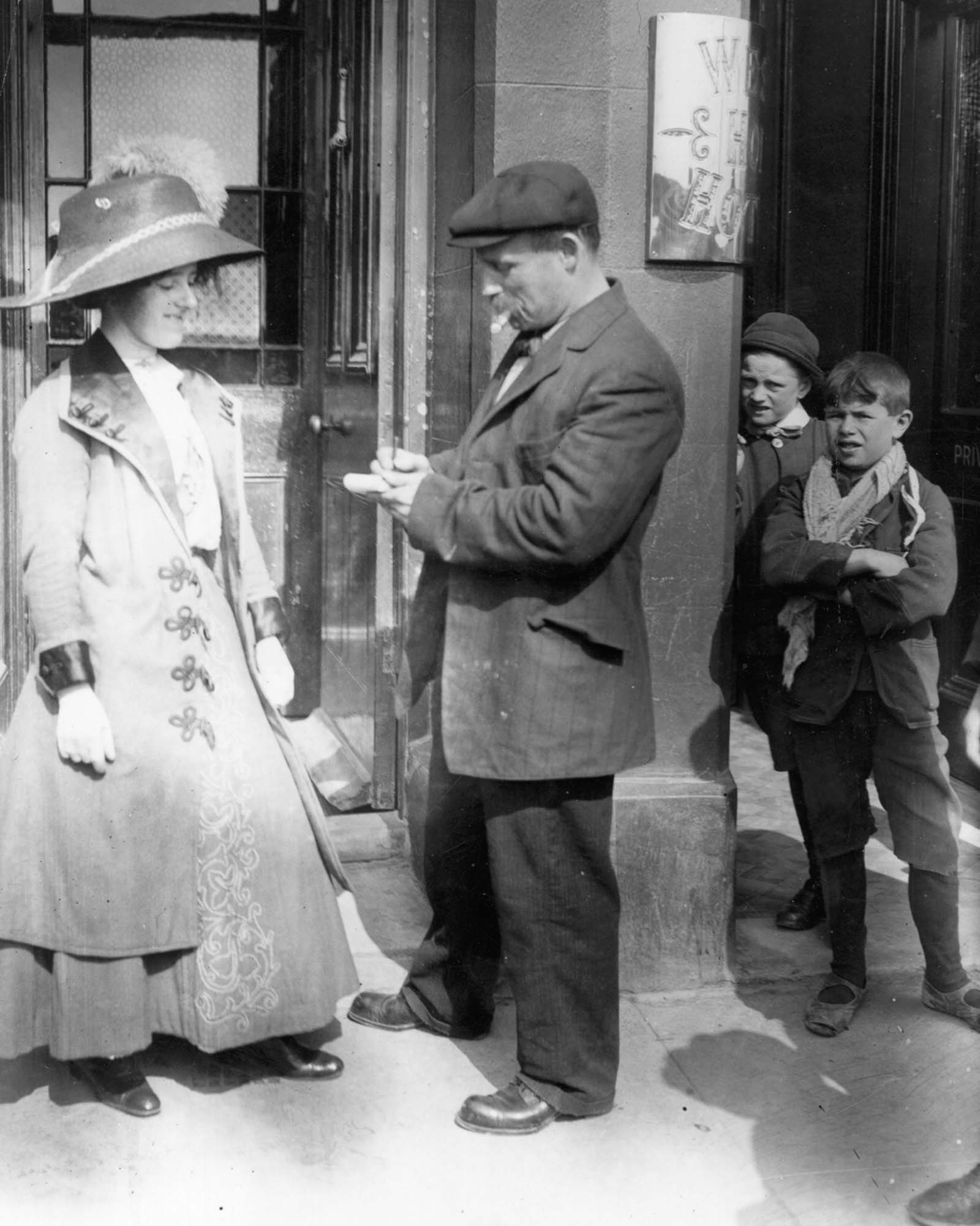 A survivor gives a woman an autograph.