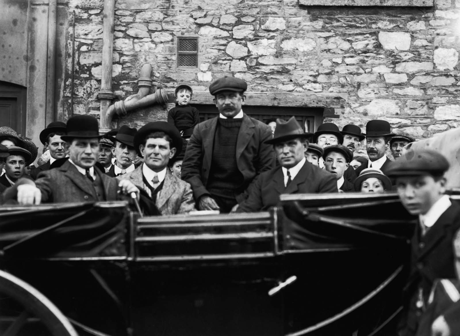 The four Pascoe brothers, crew who survived the sinking, return to Southampton.