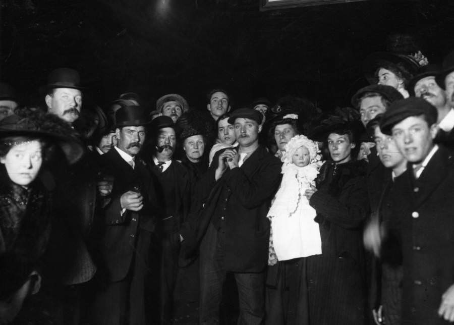 A crowd awaits the return of survivors of the Titanic sinking in Southampton, England, April 1912.