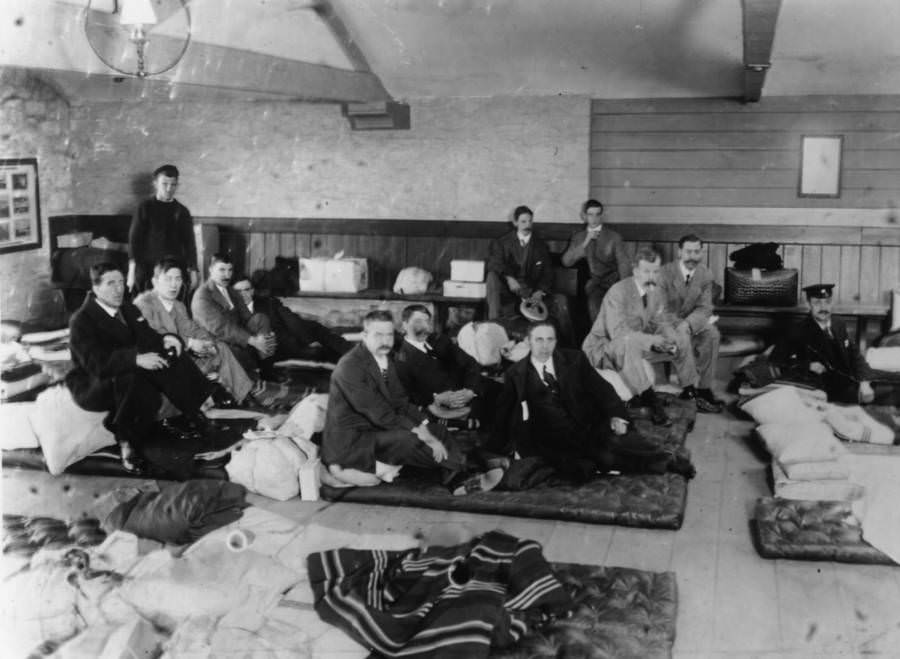 Survivors of the Titanic sinking sit at Millbay Docks in Plymouth, England upon their return home, May 1912.