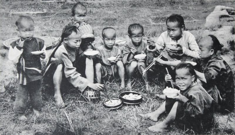 Chinese boys eating on the Hill-Side, Hong Kong