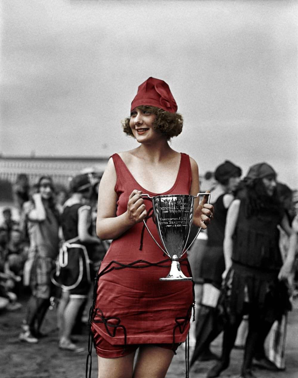 Miss Anna Neibel with her winners cup at the Washington Tidal Basin in 1922.