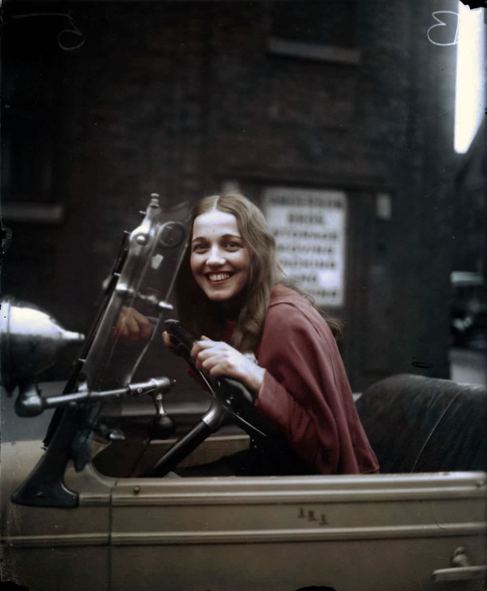 Miss Universe Ella Van Hueson sitting in her car in 1922.