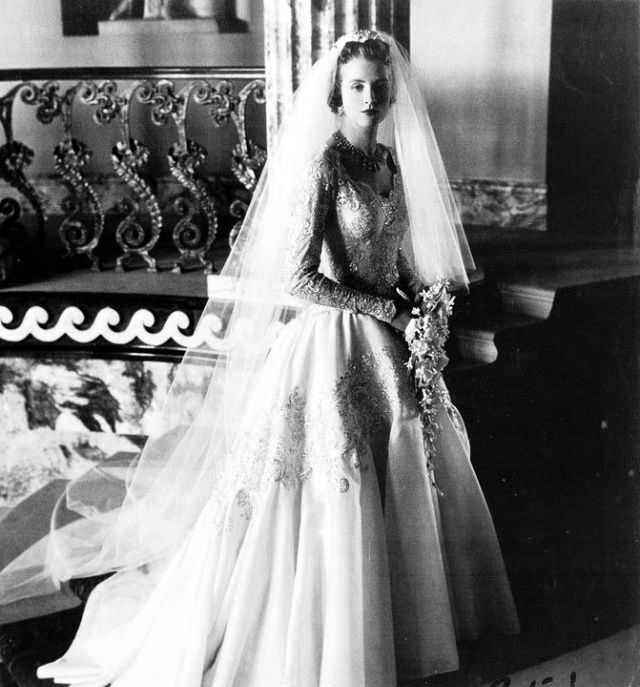 Lady Anne Glenconner in wedding gown designed by Norman Hartnell on her wedding day, 1956