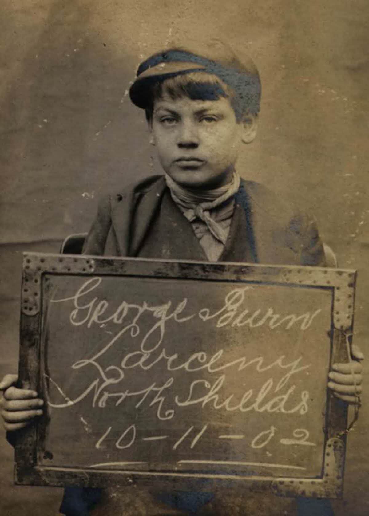 George Burn, 14, arrested for stealing brushes and a box, 1902.