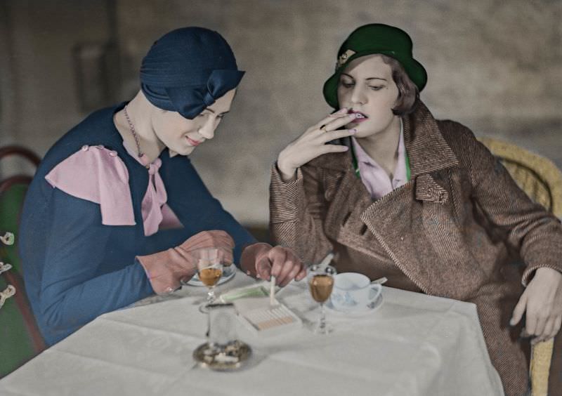 Two young ladies in Helsinki smoking and drinking cognac with coffee in the early 1930s