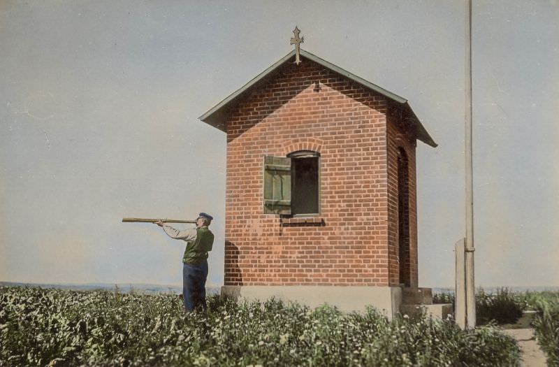 Danish pilot on the lookout for am approaching ship on the Danish island of Nyord in 1910