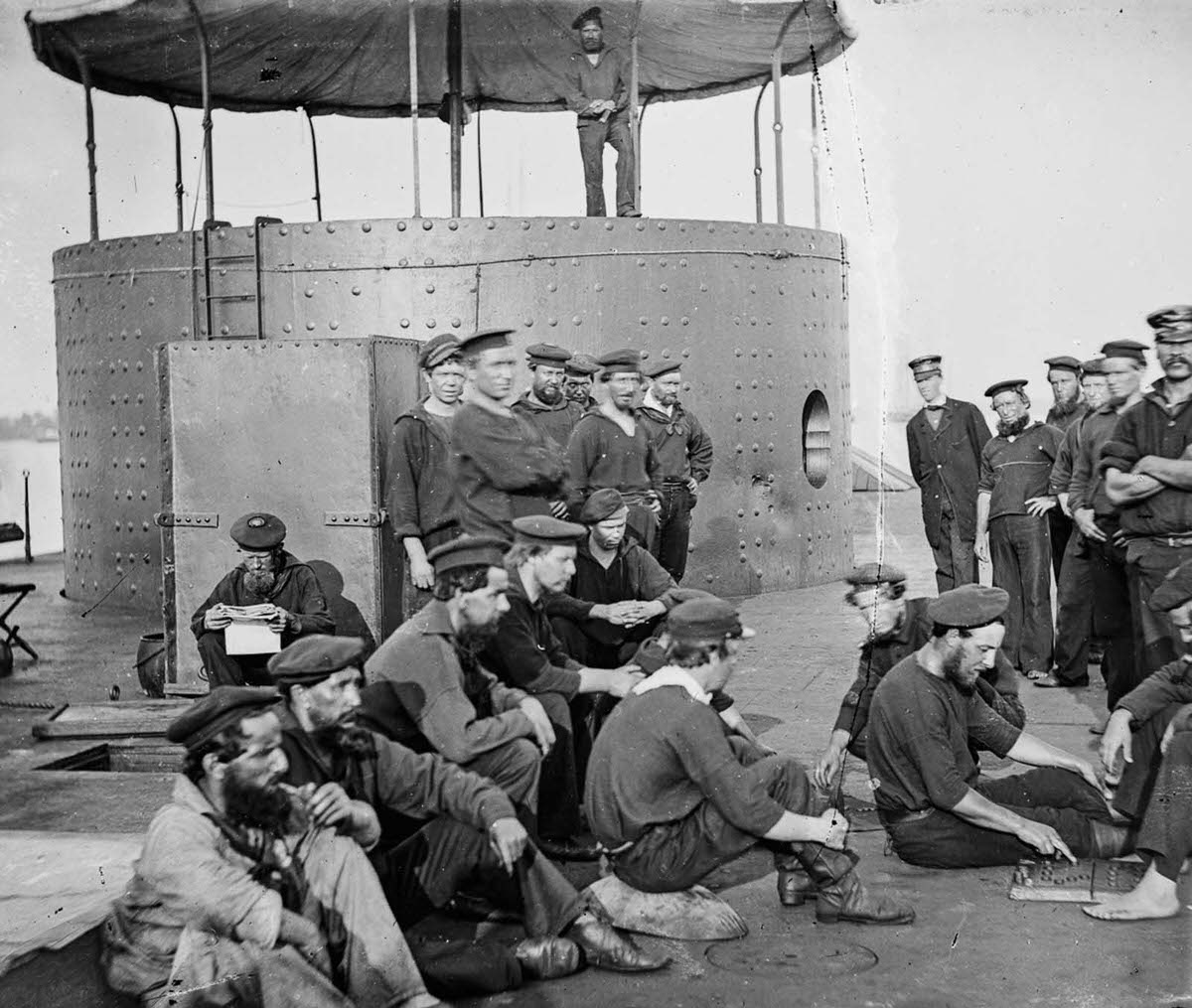 Sailors on the deck of a Monitor-class gunboat, 1864.