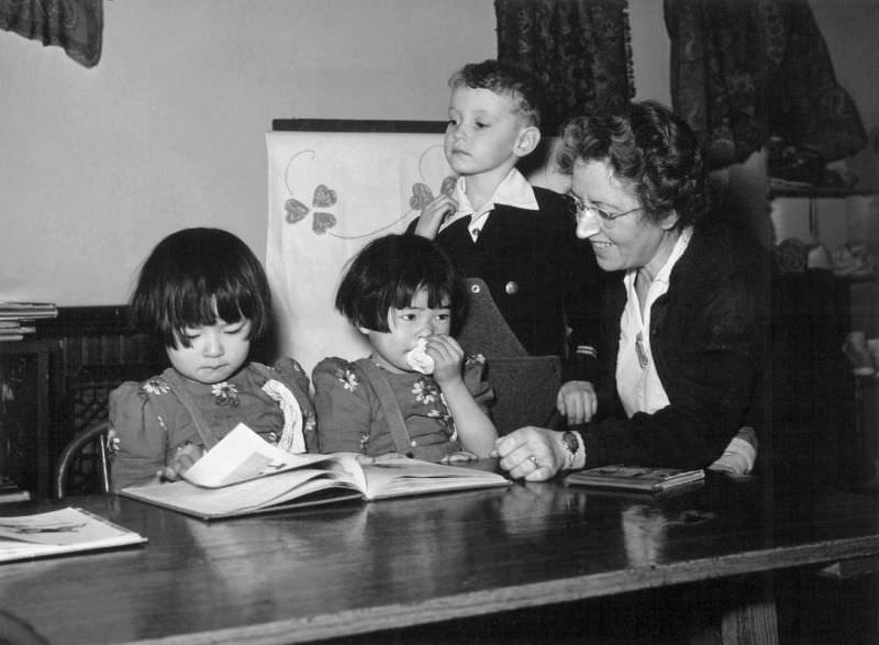 In the kindergarten of the McHenry, Illinois, grade school, the 6-year-old Okazaki twins, Sazami (left) and Toshiko (right), 1944.