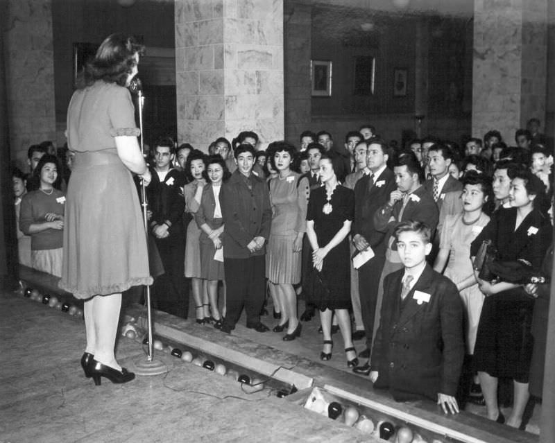 When the Nisei get together for social entertainment in Chicago, their Caucasian friends also participate in the general fun.