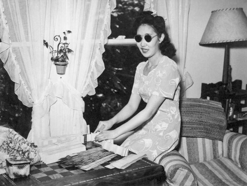 Miss Aiko Kiroki, who returned to Berkeley from Granada April 16, is seen in her comfortable home at 2411-1/2 Dwight Way, Berkeley.