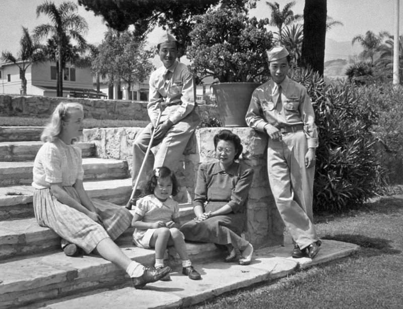 The Taki Asakuras, who arrived in Santa Barbara from Gila River are seen escorting two veterans of the 100th Infantry Battalion on a tour of Santa Barbara's scenic spots, 1945.