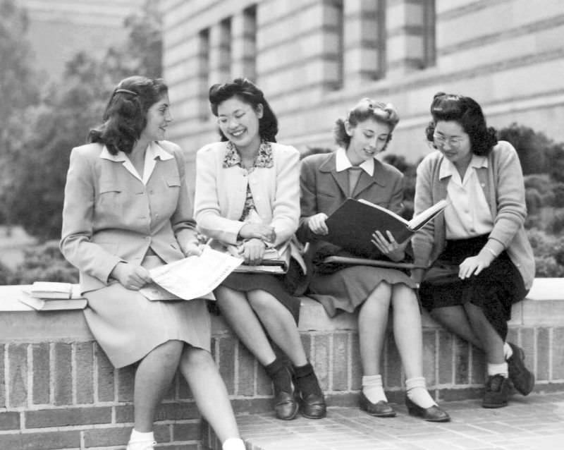Michiko Kataoka, a freshman, and Meriko Hoshiyama, a junior, both from Manzanar with fellow students.