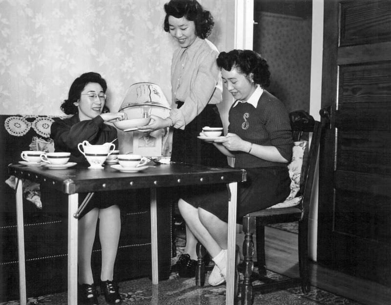 The Oda sisters like to entertain their friends in their apartment in Rockford, Illinois, 1944.