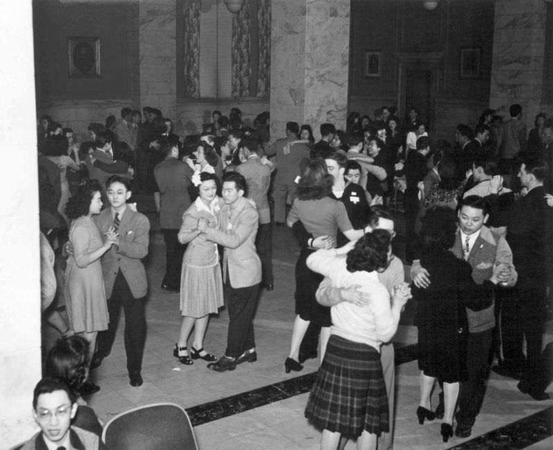 Happy Nisei and Caucasian couples throng the dance floor of the YMCA at the All-American Fun Night program in Chicago this winter, 1944.