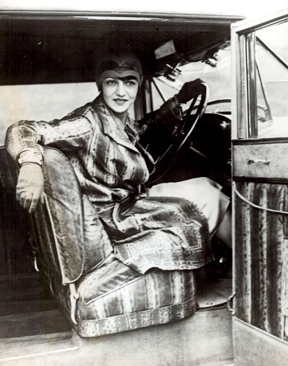 One woman can be seen wearing a snakeskin outfit coordinated with her car interior, 1927.