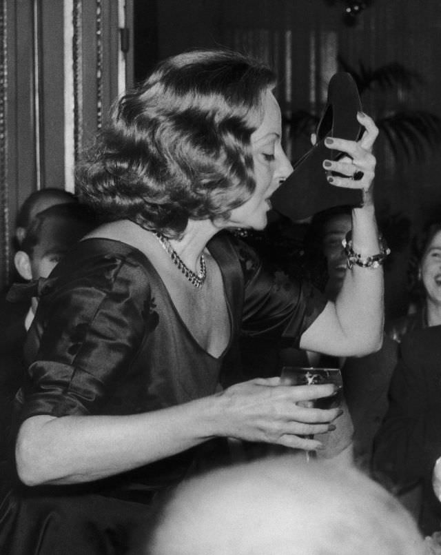 Tallulah Bankhead drinking champagne from her shoe.
