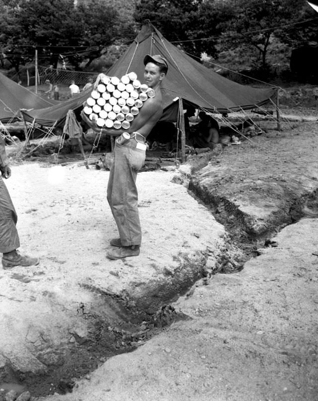 A corporal carrying a full load of beer in Korea.