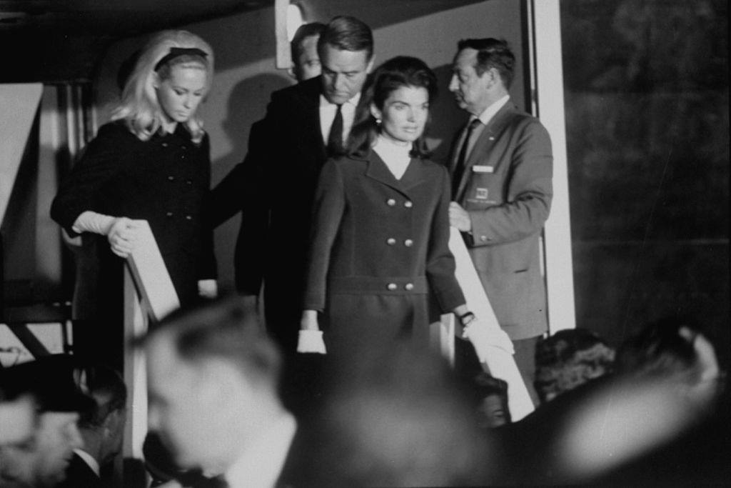 Mrs. Edward Kennedy (L), Mrs. John F. Kennedy (C) and Sargent Shriver (R) after the assassination of Robert F. Kennedy .