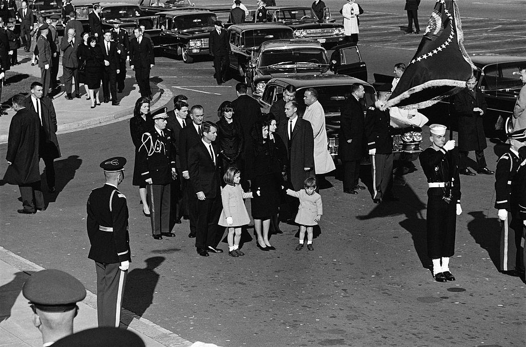Transporting the mortal remains of President John Fitzgerald Kennedy from the White House to the Capitol with his widow Jacqueline and children John John and Caroline.