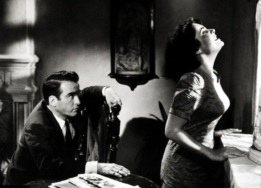 Elizabeth Taylor With the help of Dr. Cukrowicz (Montgomery Clift) is slowly remembering Catherine Holly, 1959.