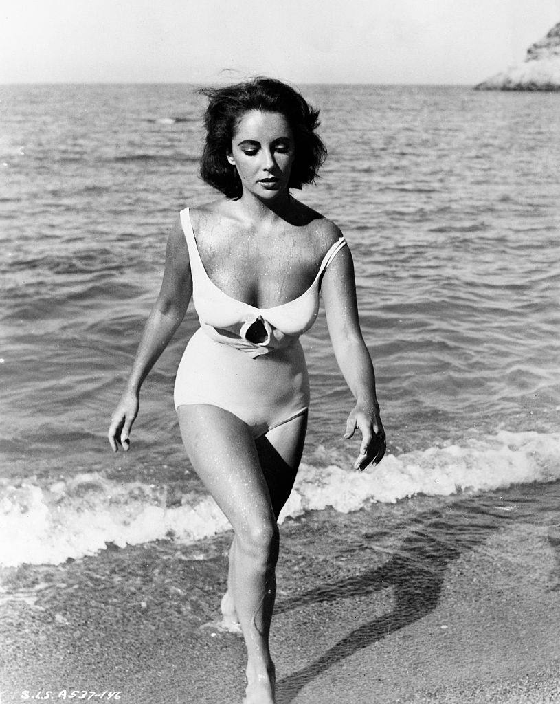 Elizabeth Taylor is shown walking onto the beach from the water in a scene from "Suddenly Last Summer."