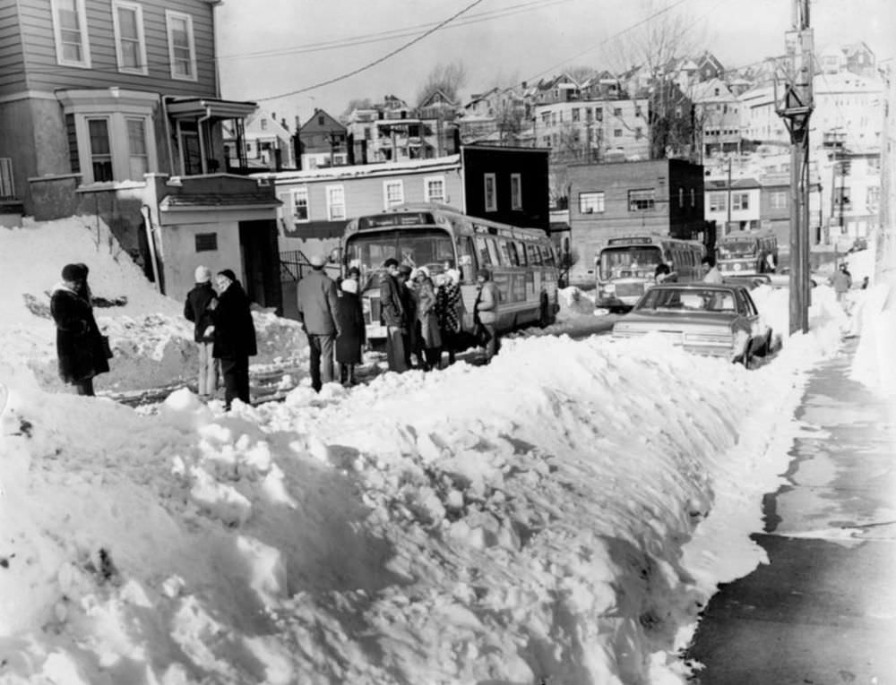 February 9, 1978, some of these people had a long wait for the bus on Victory Boulevard. in Tompkinsville, only to have it get stuck in the snow around the corner after they boarded.