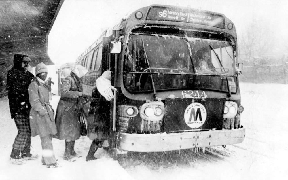 Passengers board the S-6 bus on Bay St., near the ferry, during a blizzard on February 6-7, 1978.