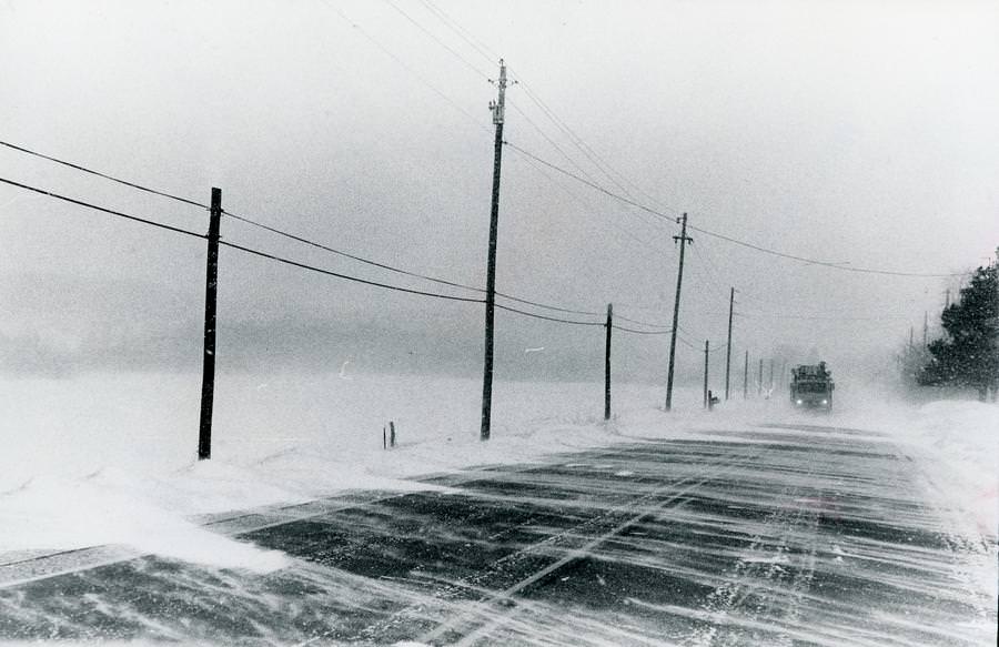 Ohio Edison trucks could barely be seen on state Route 82 east of Mantua Corners in this Jan. 27, 1978.
