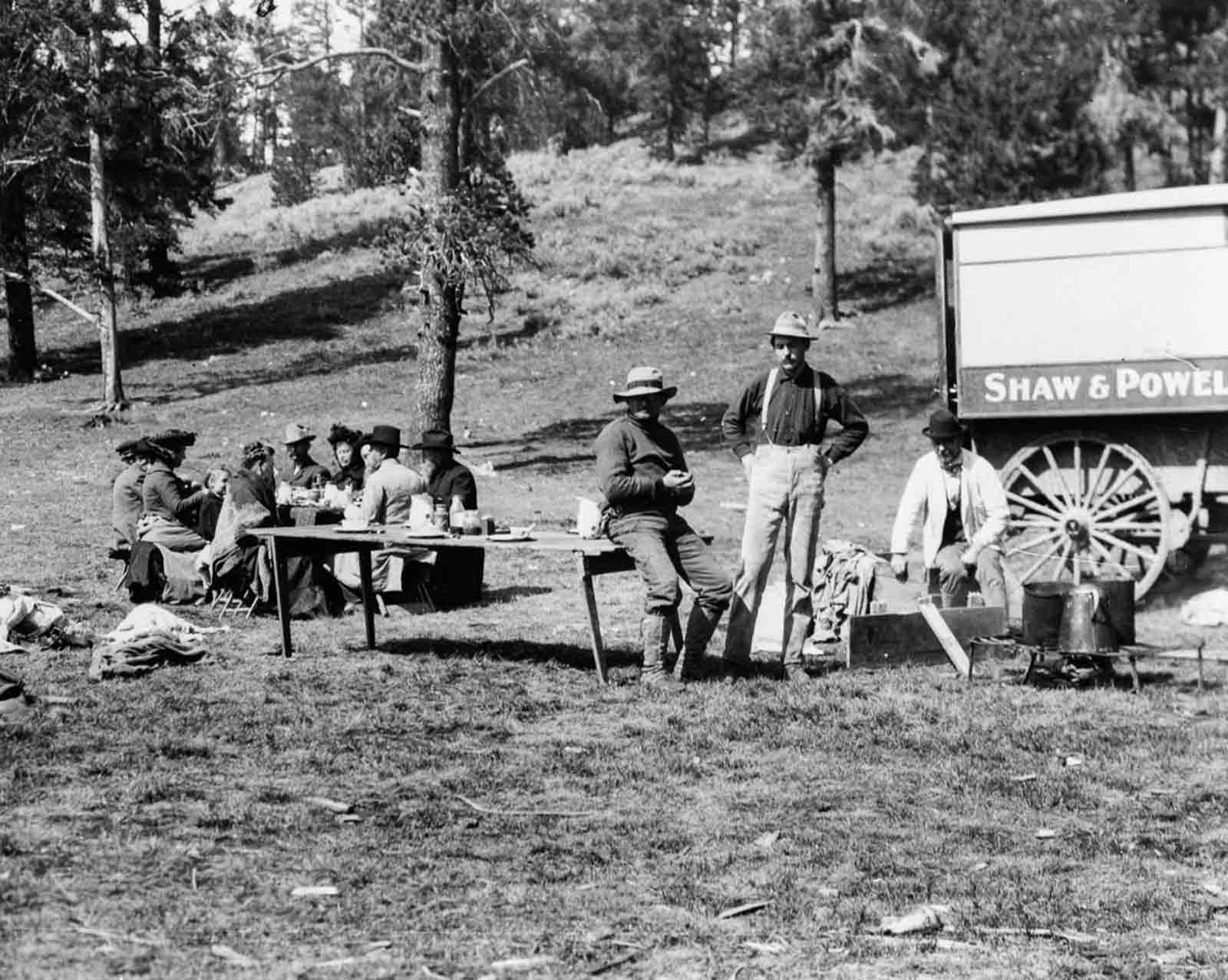 Tourists and guides picnic in Yellowstone, 1903.
