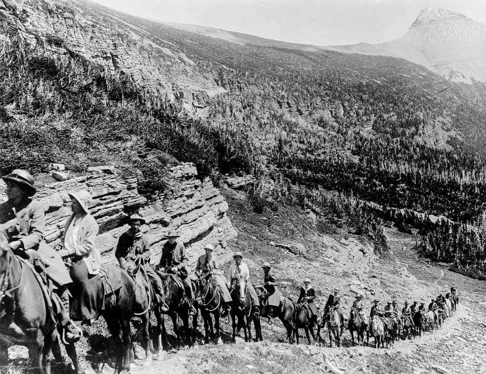 Tourists ride up a trail in Rocky Mountain National Park, 1909.