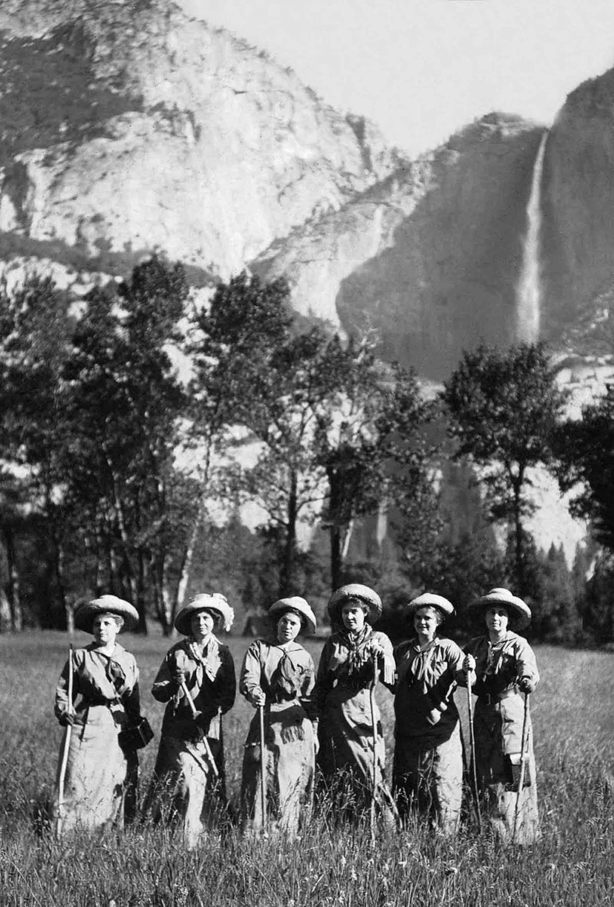 Tourists pose for a picture in front of Yosemite Falls, 1900.