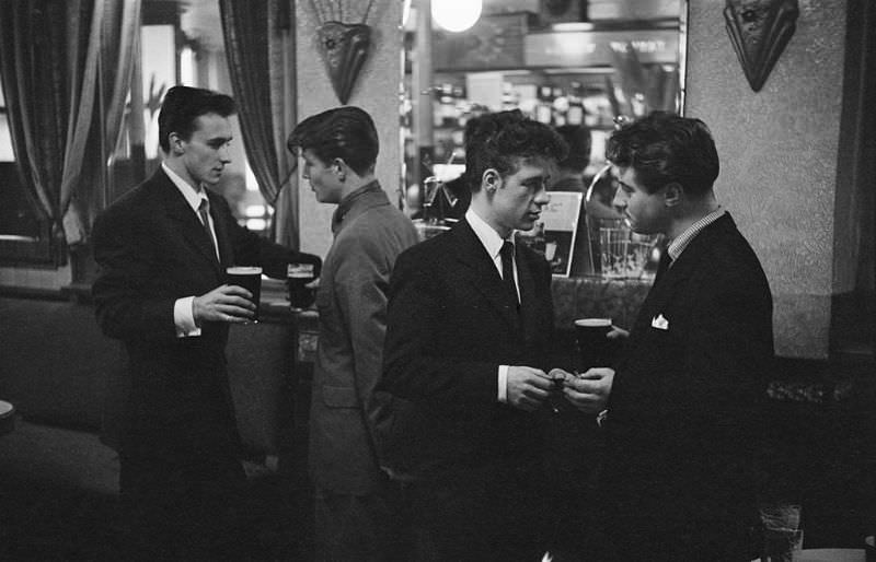 Four young men at a smart London bar, 1953.
